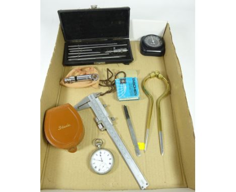 Military issue pocket watch, compass, 'The Metropolitan' whistle, brass divider, other scientific instruments in one box     