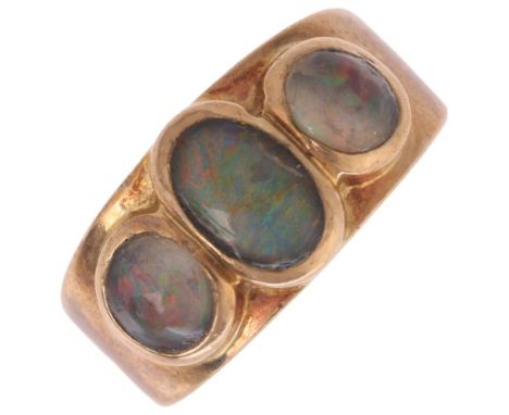 A 9ct gold three stone opal triplet band ring, maker CAT, London 1976, band width 8.4mm, size I, 3.6g . Condition Report:All 