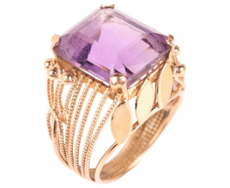 A Continental 18ct gold amethyst dress ring, set with octagonal step-cut amethyst with wirework mount, unmarked mount tests a