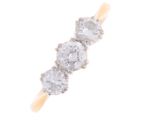 An 18ct gold three stone diamond ring, claw set with modern round brilliant-cut diamonds, total diamond content approx 0.7ct,