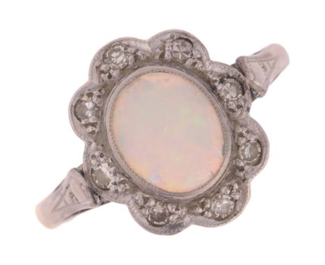 An 18ct gold opal and diamond flowerhead cluster ring, platinum-topped set with oval cabochon opal and eight-cut diamonds, se