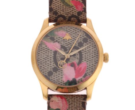 GUCCI - a lady's gold plated stainless steel G-Timeless 'Pink Blooms' quartz wristwatch, ref. 126.4, canvas style dial with l