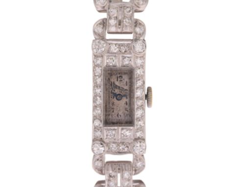 An Art Deco lady's platinum diamond cocktail wristwatch, rectangular silvered dial with Arabic numerals, blued steel syringe 