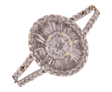 A 9ct white gold diamond cluster panel ring, set with modern round brilliant and tapered baguette-cut diamonds, total diamond