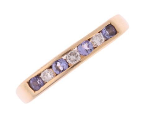 A 9ct gold tanzanite and diamond half eternity ring, setting height 3.1mm, size O, 2.1g . Condition Report:No damage or repai