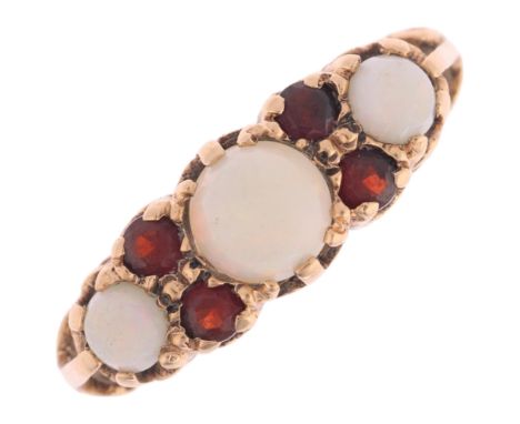 A 9ct gold opal and garnet half hoop ring, maker A&Co, London 1965, setting height 6.8mm, size L, 3.5g . Condition Report:No 