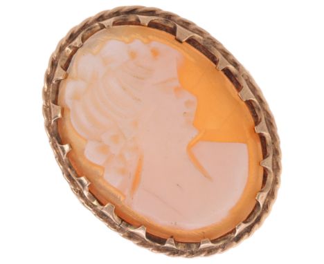 A 9ct gold shell cameo ring, relief carved depicting female profile, setting height 22.6mm, size K, 3.3g . Condition Report:C