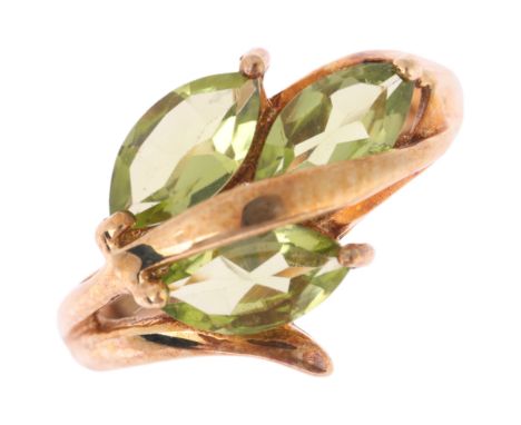 A 9ct gold peridot floral dress ring, setting height 12.4mm, size K, 3.2g . Condition Report:No damage or repair, all stones 
