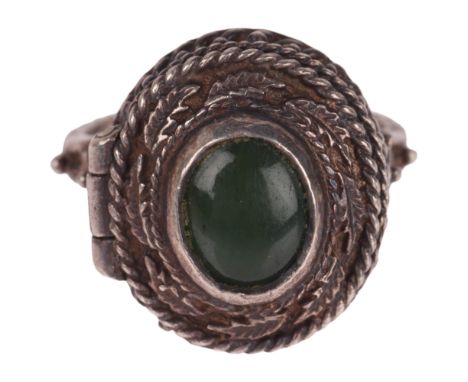 A sterling silver nephrite poison ring, with hinged top panel opening to reveal internal compartment, setting height 18.8mm, 