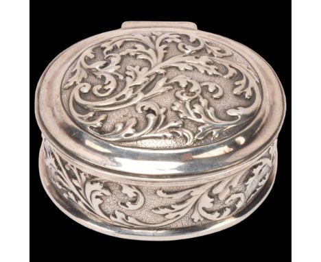 A German silver dressing table box, imported by Berthold Muller, London 1910, oval form with relief embossed foliate decorati