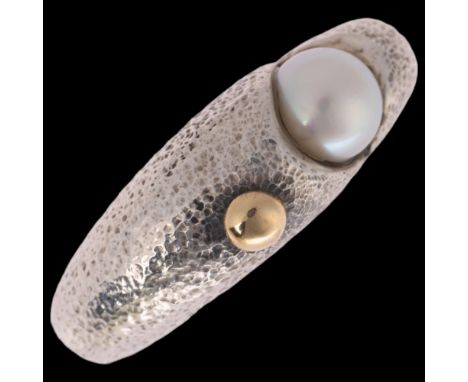 JAN JORGENSEN - a Danish modernist sterling silver cultured pearl abstract ring, with applied silver-gilt ball and planished 