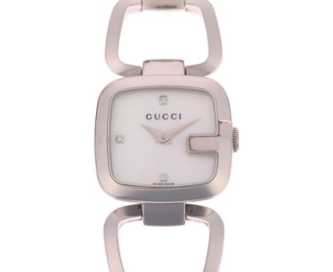 GUCCI - a lady's stainless steel G-Timeless quartz bracelet watch, ref. 125.5, white mother-of-pearl dial with diamond hour m