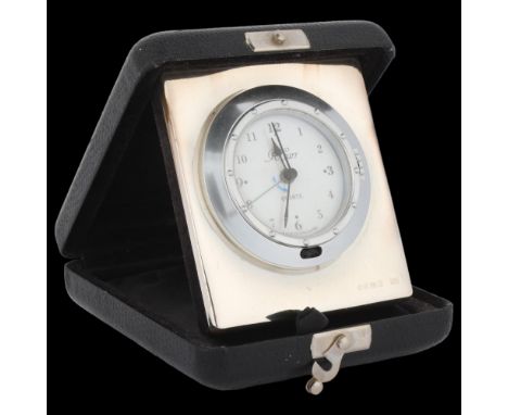 An Elizabeth II silver-fronted travelling bedside quartz clock, Carr's of Sheffield, Sheffield 1998, case 11cm x 9cm . Condit