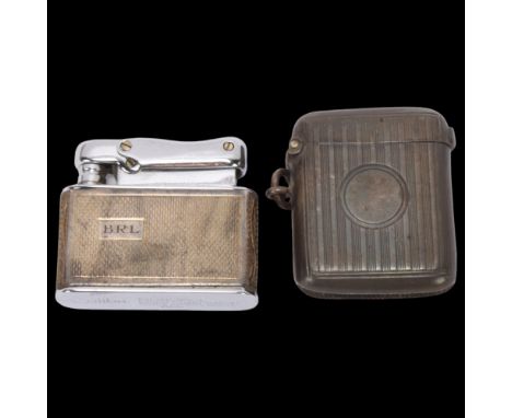 A cased silver Colibri Monopol gas lighter, and a silver Vesta case, 4.5cm (2) . Condition Report:Lighter cartouche has engra