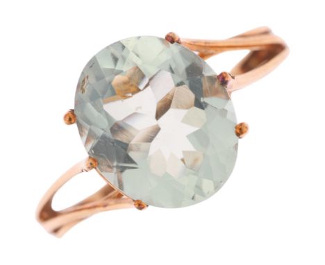 A 9ct gold prasiolite dress ring, claw set with oval mixed-cut prasiolite, setting height 11.9mm, size P, 2.4g . Condition Re