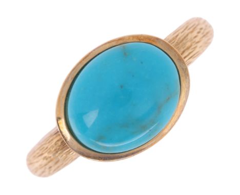 A 9ct gold single stone turquoise dress ring, with textured shoulders, setting height 9.2mm, size K, 2.9g . Condition Report: