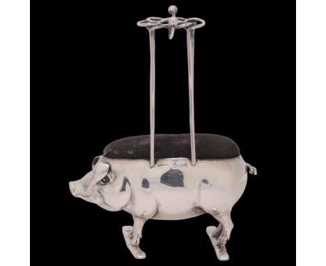 An Edwardian novelty silver pig hat pin cushion, Adie & Lovekin Ltd, Birmingham 1905, height 10.5cm . Condition Report:Genera