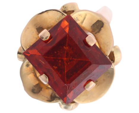 A late 20th century hessonite orange garnet dress ring, claw set with 9ct rectangular step-cut garnet, apparently unmarked, g