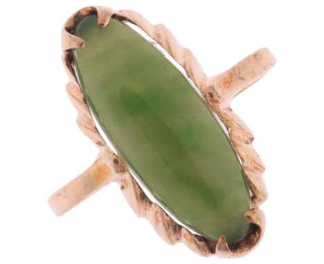 A 9ct gold jadeite panel ring, set with marquise cabochon jade, setting height 20.5mm, size M, 2.7g . Condition Report:No dam