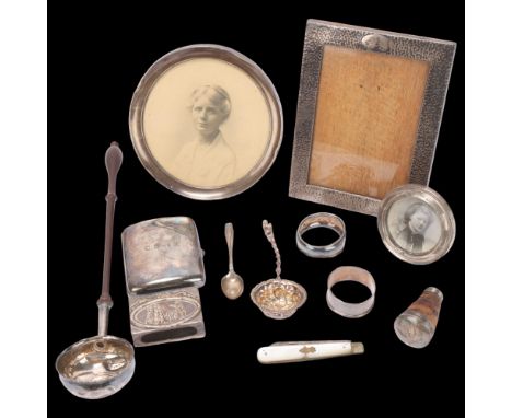 Various silver, including coin inset toddy ladle, cigarette case, photo frames, etc . Condition Report:Lot sold as seen unles