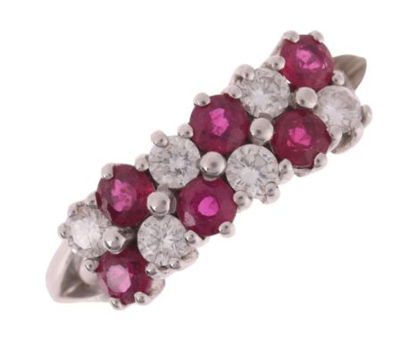 An 18ct white gold ruby and diamond double-row half hoop ring, claw set with round-cut rubies and modern round brilliant-cut 