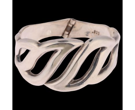 A large Danish modernist sterling silver openwork hinged bangle, with spring fitting, setting height 35.4mm, internal circumf