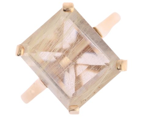 A 9ct gold rutilated quartz dress ring, claw set with rectangular step-cut quartz, setting height 12.6mm, size N, 3.3g . Cond