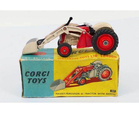 Corgi - A boxed Massy Ferguson 65 Tractor with shovel # 53. The model appears Near Mint with only a few minor marks, the box 