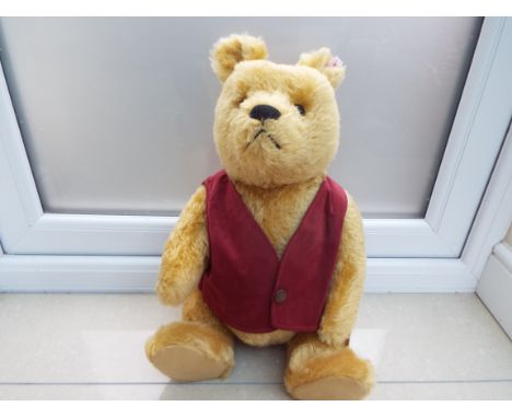 Steiff  - Winnie the Pooh with red waistcoat, fitted growler, issued in a limited edition of 3500 (No 02318), white tag to th