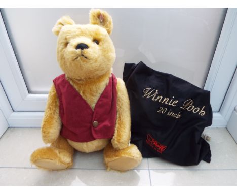 Steiff  - Winnie the Pooh with red waistcoat, fitted growler, issued in a limited edition of 3500 (No 02160), white tag to th
