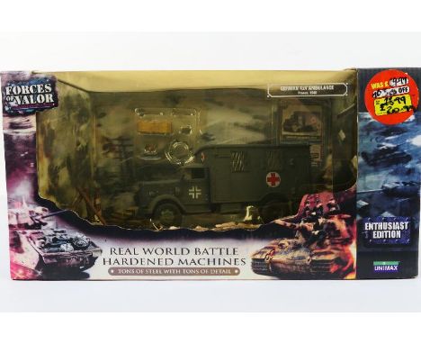 Forces of Valor - A boxed 1:32 scale Forces of Valor #80073 diecast WW2 German 4x4 Ambulance (France 1940). The model appears