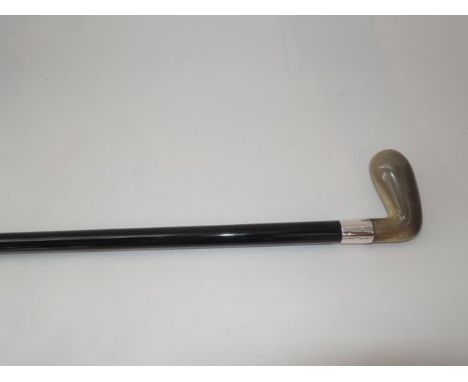 An ebonised walking cane/Sunday stick with polished horn handle and applied silver collar, stamped Brigg, London 1984