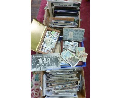 A collection of various vintage cigarette cards and albums, a small collection of postcards, a box of mint stamps in presenta