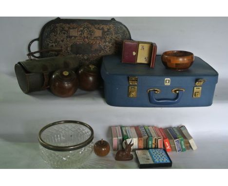 A vintage Crown Luggage suitcase containing a quantity of boxed playing cards, a leather case containing two vintage boules s