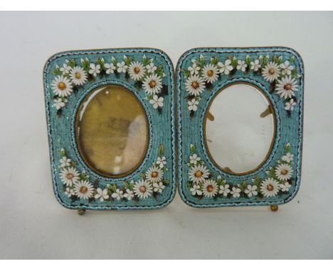 A 19th century Italian photograph frame encrusted with micro mosaic work, pale turquoise ground raised with daises with easel
