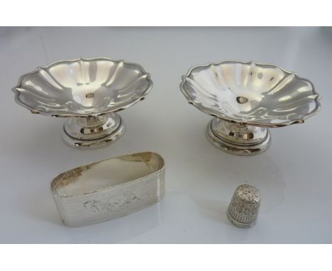 A pair of George V silver bon bon dishes, indecipherable maker's mark, Birmingham, 1910, each fluted bowl on a spreading pede