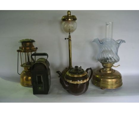 A Bialaddin lamp Model No 300X with cylindrical clear Pyrex chimney, a brass tilly lamp, a substantial brass oil lamp with cl