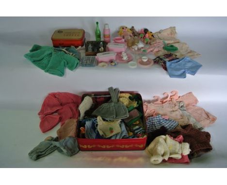 A quantity of vintage dolls clothing, further smaller knitted items of dolls clothing, etc together with a dolls miniature pi