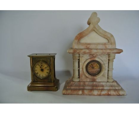 A Victorian alabaster mantle clock in a lancet shaped case with turned column supports enclosing an 8-day timepiece, together