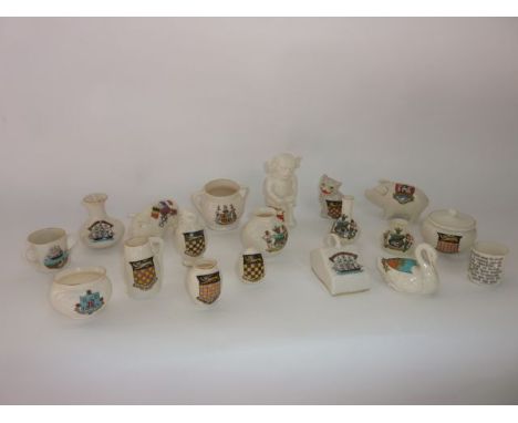 A quantity of W H Goss and other crested wares including an Asbury pig with the flags of Russia, Japan, France, Belgium and G