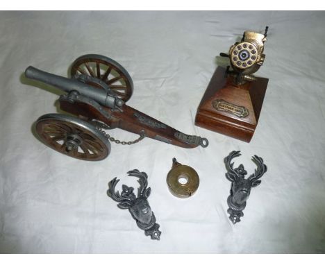 A vintage turned timber policeman's truncheon, together with a Royal South Wales Borderer's military badge, a further Welsh c