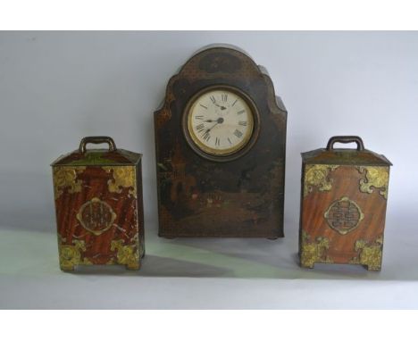 A vintage printed tin clock surround with simulated lacquer detail with chinoiserie influenced lacquer detail depicting orien