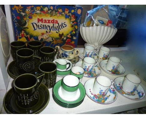 A collection of Crown Staffordshire coffee wares with printed hollyhock decoration comprising six coffee cans and five saucer