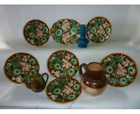 A collection of 19th century majolica dessert wares with moulded and painted floral and leaf decoration on a brown ground, co