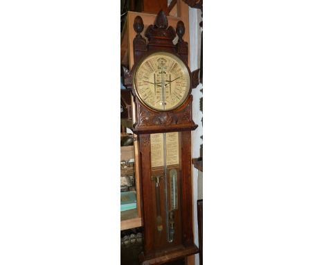 A Victorian Admiral Fitzroys barometer in a carved oak case with paper dial - The Improved Barometer, invented by Torrigelli