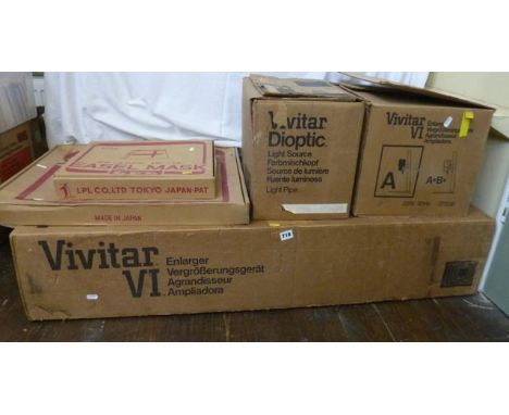 A Vivitar VI Enlarger Framework together with a Vivitar VI Enlarger, a Vivitar Droptic light source and two easel masks