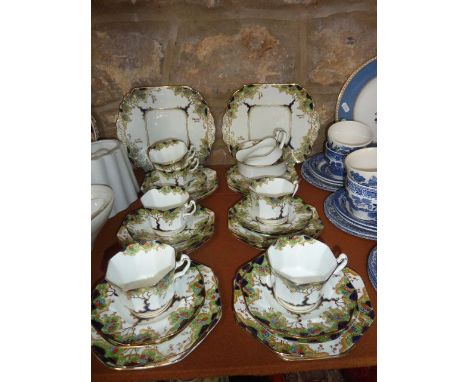 A collection of Fenton China tea wares in the June pattern comprising a pair of cake plates, milk jug, sugar bowl, six cups, 