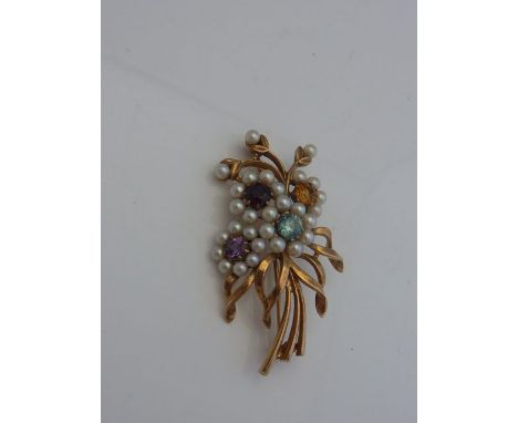 A gem-set floral spray brooch, set with topaz, citrine, amethyst, garnet and pearl, in unmarked gold