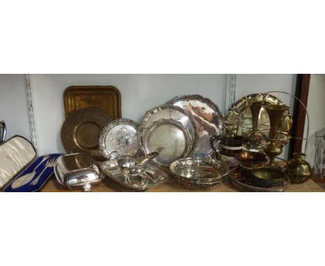 A quantity of silver plated wares to include a tray of circular form with pie crust border raised on four scrolling supports,