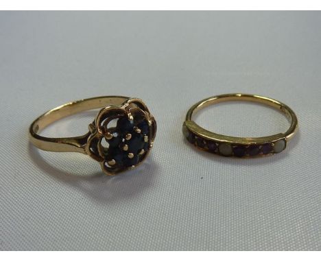 A sapphire cluster ring, with flower head motif, in 9ct gold, size M; and a ruby and pearl ring, set with a row of six round 